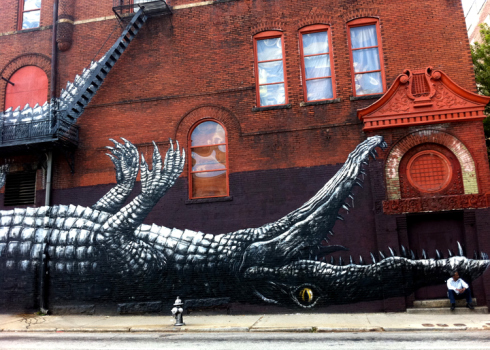 Since 1929, 209 Mitchell Street has been home to Friedman’s Shoes. In 2011, Living Walls added a giant alligator to the exterior. Alligator on the inside has been a staple for decades.