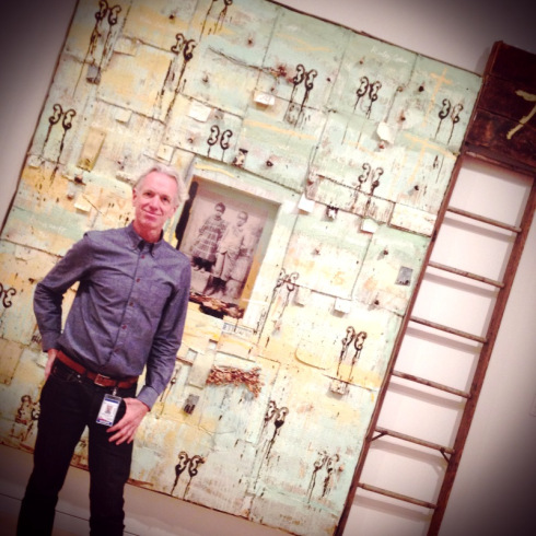 Michael Lachowski at Georgia Museum of Art. Painting by Radcliffe Bailey. Photo credit: Gene Kansas.