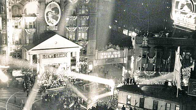 300,000 people line the streets outside Loew's Grand.